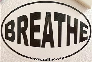 'Breathe, www.zaltho.org' magnet on refrigerator'