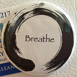 'Breathe' enso magnet on refrigerator