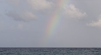 Rainbow over the  Gulf just after full moon June 23, 2013