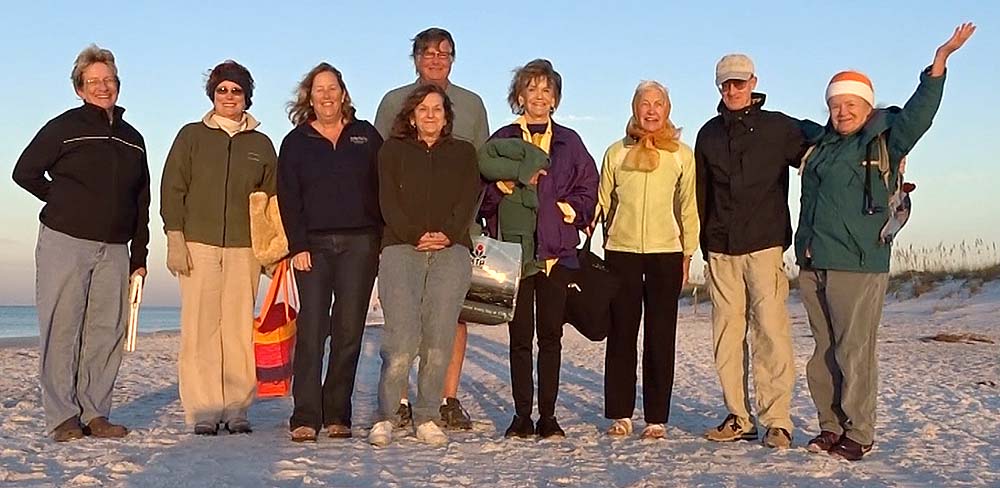 Sunrise meditators on the beach at Topsail Hill Preserve State Park for Back to Nature Festival.