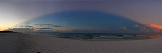 Sunrise on 9/24/2018 from the backlit dawn cloud arching over the gulf to full moon territory, which was banked in with sun pinked huge cloud