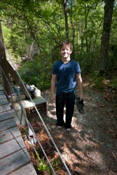 Hiker between bridge and creek