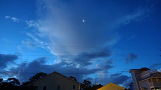 Moon misted over in the sky to the E