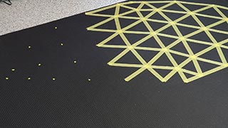 Pressing tape firmly and completely to keep paint out, connect the dots