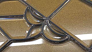 Beveled glass panel under repair