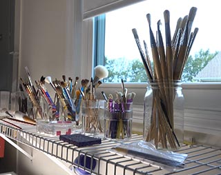 Brushes in the painting and firing room