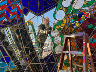 Installing the last panel on Wholeo Dome